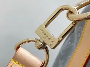 Louis Vuitton bag gold-tone metal clasp beige leather strap with yellow stitching close-up detail