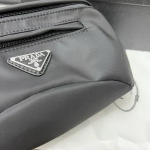 Prada nylon cloth waist bag featuring logo triangle and zippered compartment, showcasing high-quality replica design.