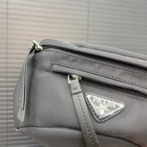 Prada nylon cloth waist bag featuring a signature logo, sleek design, and zipper detail, ideal for men and women.