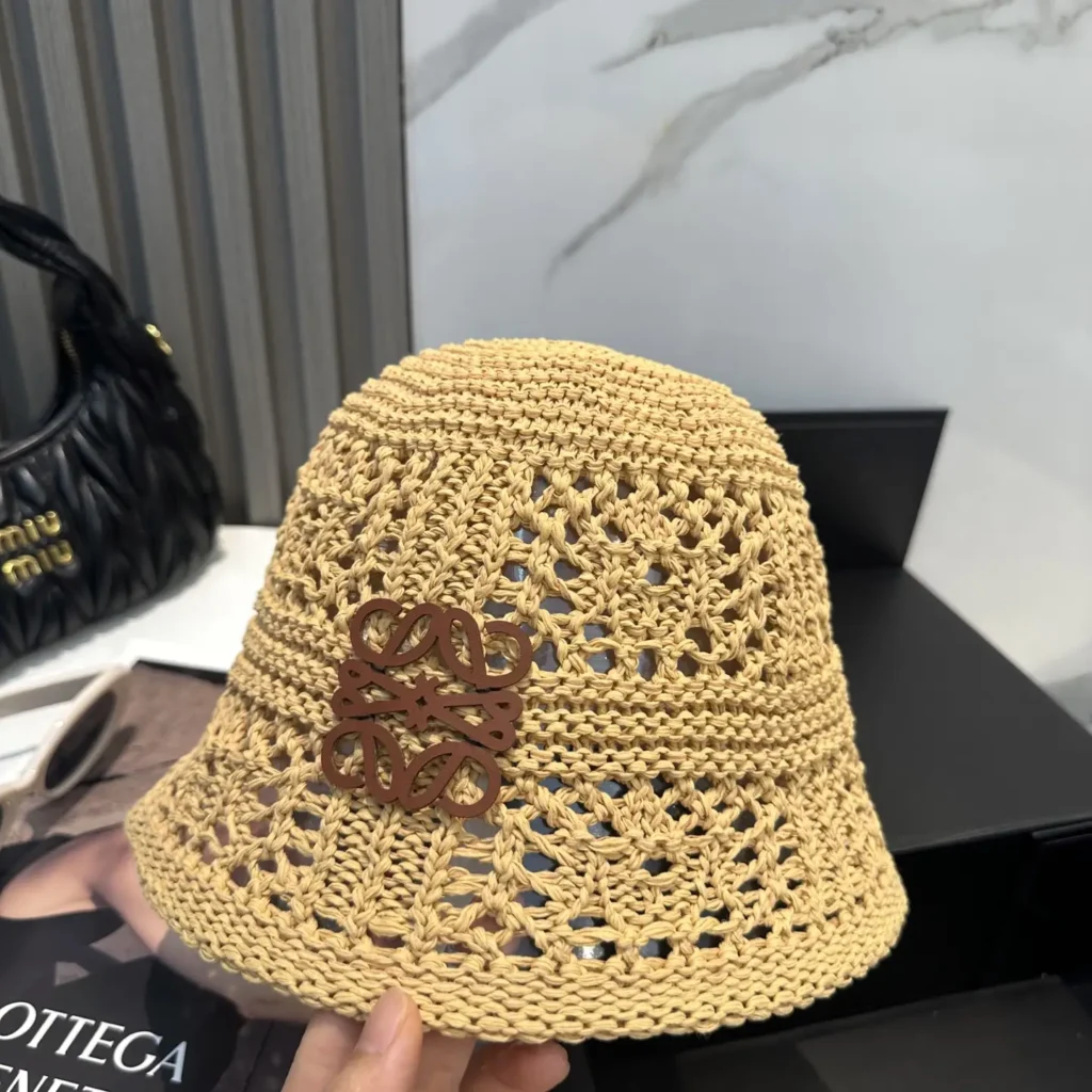 Loewe crochet bucket hat beige woven raffia with brown leather emblem accessory