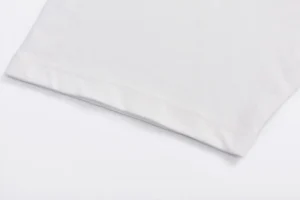 Given only this image of a white fabric edge, there is insufficient visible information to generate SEO-optimized alt text including brand, model, style, color, and material details as instructed. Please provide an image showing more distinctive features or product labels.