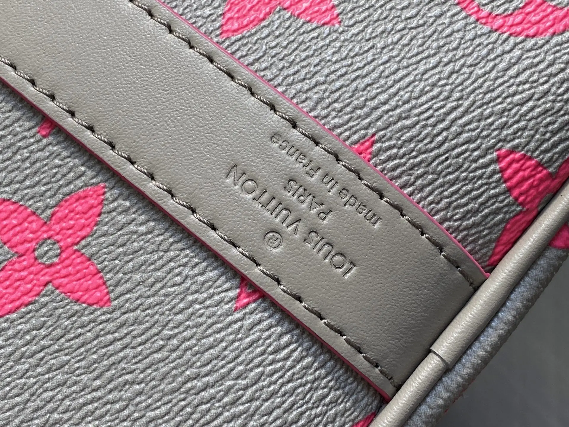 Louis Vuitton bag beige pink monogram coated canvas leather detail made in France close-up stitching
