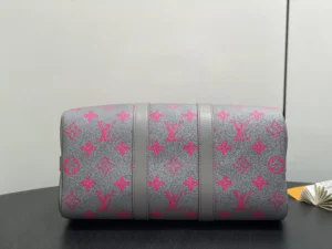 Louis Vuitton Keepall 55 monogram canvas duffle bag grey with pink logo accents and leather trim