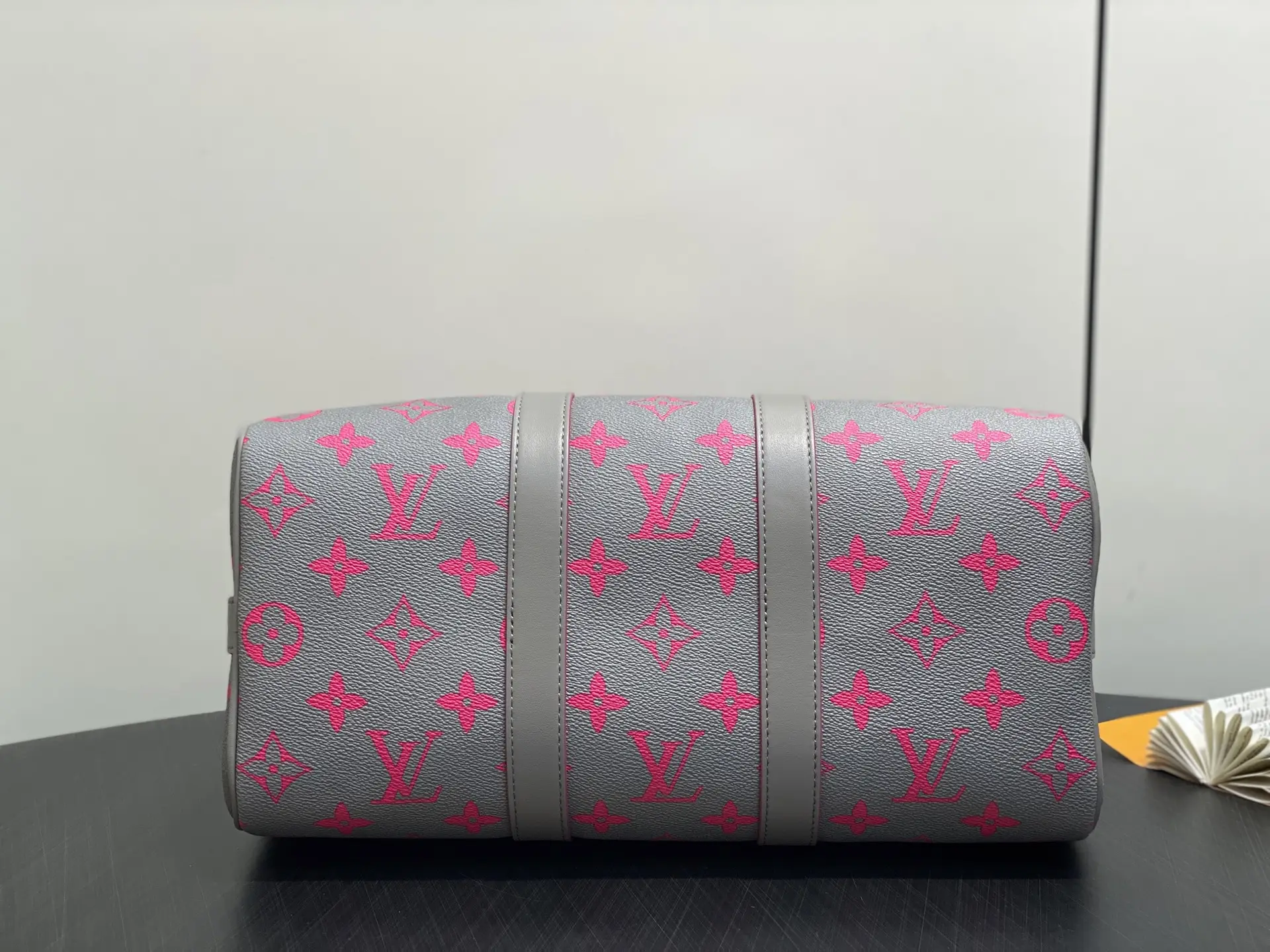 Louis Vuitton Keepall 55 monogram canvas duffle bag grey with pink logo accents and leather trim
