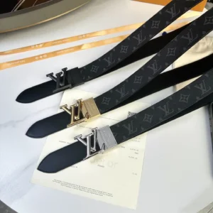 L0UIS VUITT0N Donkey Men's Belts displayed on a table, featuring black canvas with LV logo and gold/silver hardware accents, showcasing luxury replica accessories.