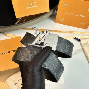 L0UIS VUITT0N Donkey Men's Belt displayed with silver logo buckle and signature canvas, surrounded by branded packaging.