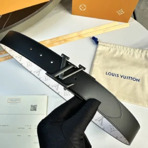 L0UIS VUITT0N Donkey Men's Belt in black leather with double-sided design, showcasing logo and packaging, emphasizing luxury craftsmanship and versatility.