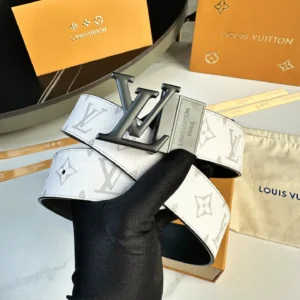 L0UIS VUITT0N Donkey Men's Belt featuring a white canvas design with iconic LV monogram, held in a gloved hand, displayed alongside branded packaging and a dust bag.