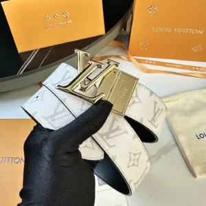 Men's L0UIS VUITT0N Donkey belt featuring a white canvas design with LV logo buckle, held in a gloved hand, presented with branded packaging.