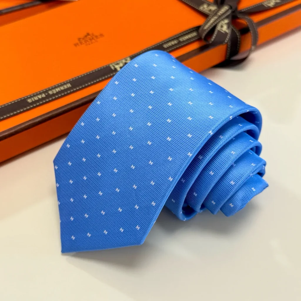 Hermès silk tie blue color with subtle white dot pattern luxury accessory