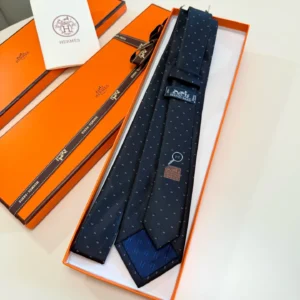 Hermes tie black patterned silk necktie with signature logo in orange box packaging