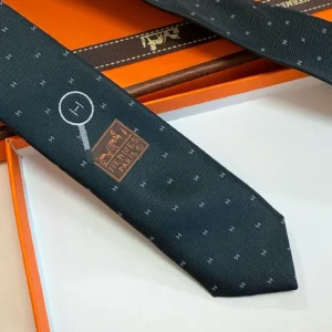 Hermes silk tie navy blue pattern with magnifying glass and logo in brown leather box