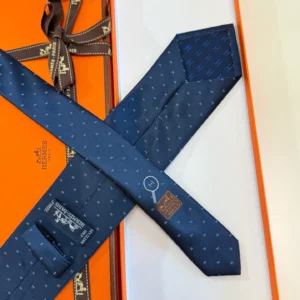 Hermes necktie blue silk with subtle patterned design luxury men's accessory in orange box