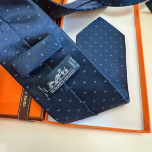 Hermès silk tie navy blue micro pattern luxury accessory made in France