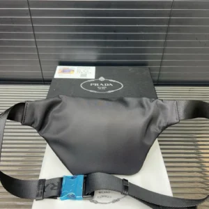 Prada belt bag black nylon with adjustable strap and branded black buckle accessory