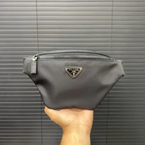 Prada Re-Edition 2005 small pouch black nylon bag with silver logo plaque and zipper closure