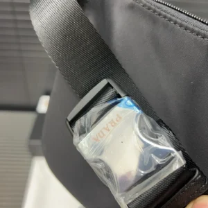 Prada Nylon Waist Bag strap detail featuring logo tag and buckle.