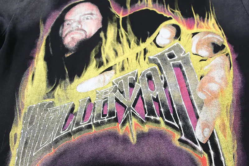 No brand name visible on graphic hoodie with a flame design and person pointing hand illustration in yellow and purple colors