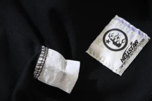 Heist Apparel black clothing tag 100% cotton fabric with NFC authentication logo