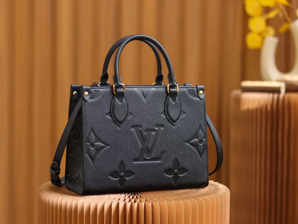Louis Vuitton OnTheGo GM black monogram embossed leather tote bag with top handles and shoulder strap