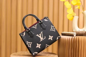 Onthego PM Bicolor Monogram Empreinte Leather Bag by Louis Vuitton, featuring black and beige leather, iconic LV logo, and elegant design, displayed against a textured backdrop.