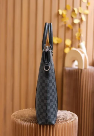 Montaigne BB Monogram canvas handbag displayed against a wooden backdrop, showcasing its sleek design and checkered pattern.