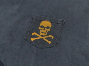 Repsgoat black cotton t-shirt with yellow skull and crossbones graphic on pocket