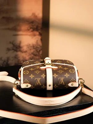 Louis Vuitton Chip Jumping Code Upgraded Gemini Series bag in classic brown and white, featuring iconic monogram pattern, adjustable shoulder strap, and elegant design on a stylish background.