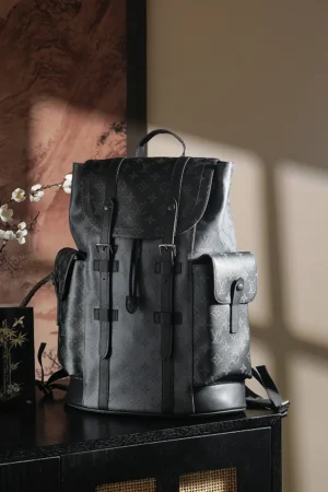 Chip Diamond Jumping Code Backpack by Louis Vuitton, featuring a stylish black design, multiple pockets, and a vintage-inspired buckle closure, set against a softly lit background.