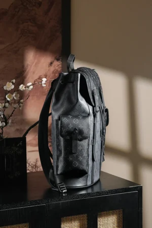 Chip Diamond Jumping Code Backpack by Louis Vuitton, featuring a sleek black design, showcased in a stylish interior setting with soft lighting and decorative elements.