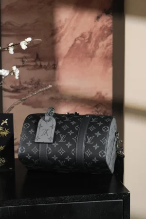 Luxury Louis Vuitton Chip Diamond Jumping Code Series bag in black vintage color scheme, showcasing iconic monogram pattern and stylish design, displayed on a dark surface with decorative elements in the background.