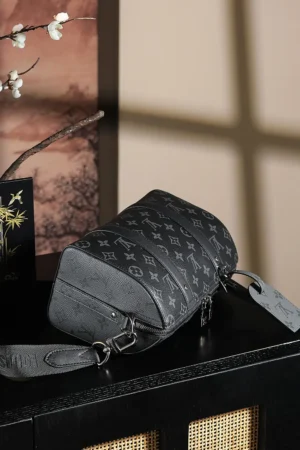 Louis Vuitton Chip Diamond Jumping Code Series bag in black vintage color, showcasing a sleek design with logo pattern, placed on a stylish surface with decorative elements in the background.