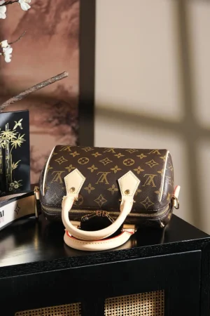 Louis Vuitton Speedy 25 handbag brown monogram canvas beige leather handles small size bag