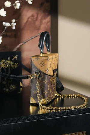 Louis Vuitton Petite Malle 19 mini bag brown monogram coated canvas black leather gold hardware