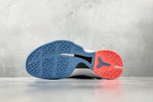 Nike Kobe AD basketball sneakers white black blue red rubber outsole close-up view