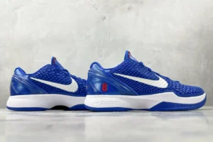 Nike Zoom Kobe 6 Protro “Dodge” sneakers in blue with white swoosh, showcasing a textured upper and red detailing, ideal for sneaker enthusiasts and available for purchase.