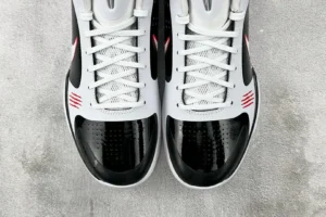 Nike Air Jordan 11 Concord black white red patent leather sneakers with mesh upper and iconic design