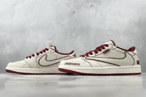 Nike Air Jordan 1 Low OG Undefeated Sail Team Red leather sneakers with signature branding details