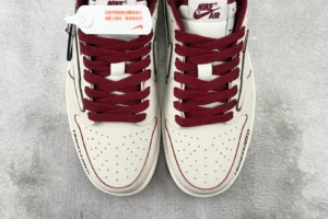 Nike Air Jordan 1 High OG Undefeated white maroon leather sneakers with perforated toe box and branded tag