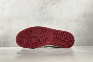Nike Air Jordan 1 High OG red outsole rubber sneakers with classic tread pattern visible from bottom view