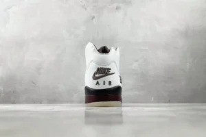 Nike Air Jordan 5 Fire Red white black burgundy leather sneakers rear view on concrete floor