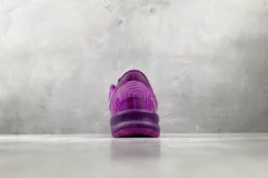 Nike Kobe AD NXT purple white synthetic basketball sneakers rear view on concrete floor