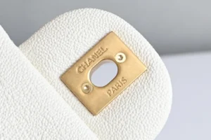 Chanel bag white textured leather with gold-tone metal lock plate engraved Chanel Paris