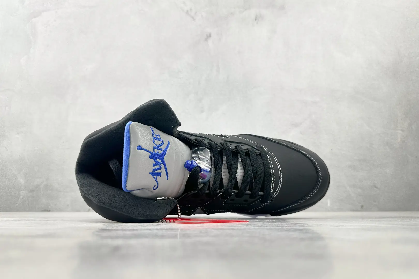 Nike Air Jordan 5 Retro black varsity royal white leather sneakers with lace lock and embroidered tongue logo