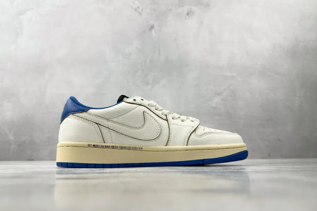Nike Jordan 1 Low Travis Scott DA2345-112 white blue leather sneaker with cream midsole and printed text detail