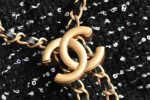Chanel necklace gold-tone metal chain black leather intertwined double C logo accessory