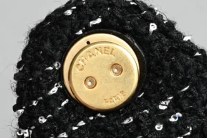 Chanel button black tweed fabric with gold-tone metal engraved Chanel Paris logo with screws