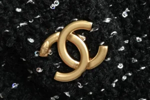 Chanel brooch black tweed fabric with gold-tone metal interlocking CC logo accessory