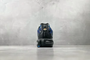 Nike Air Max Plus TN black royal blue leather sneakers with visible Air cushioning and synthetic overlays