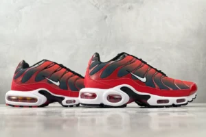 Nike Air Max Plus red black white synthetic mesh sneakers with visible air cushioning units